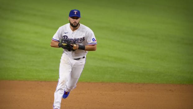 Jun 19, 2021; Arlington, Texas, USA; Texas Rangers shortstop Isiah Kiner-Falefa (9) makes a force out against the Minnesota Twins during the fourth inning at Globe Life Field. Mandatory Credit: Jerome Miron-USA TODAY Sports